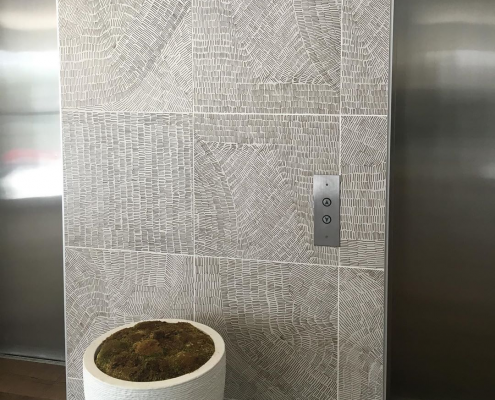 Elevator Area Featuring Fossil Grey Tiles